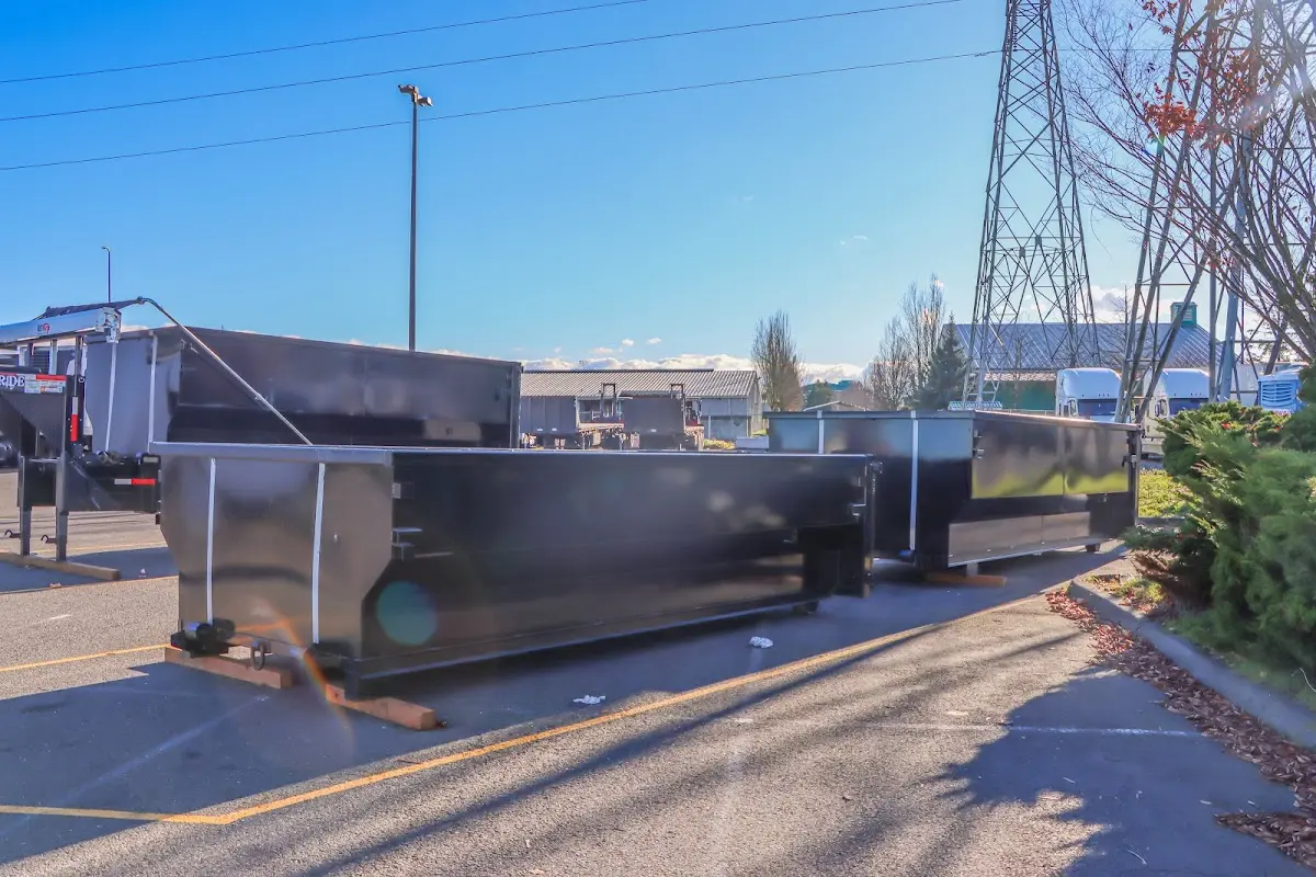 Roll-off dumpster ready for waste disposal at job site for Concrete Dumpster Rental in Clementon